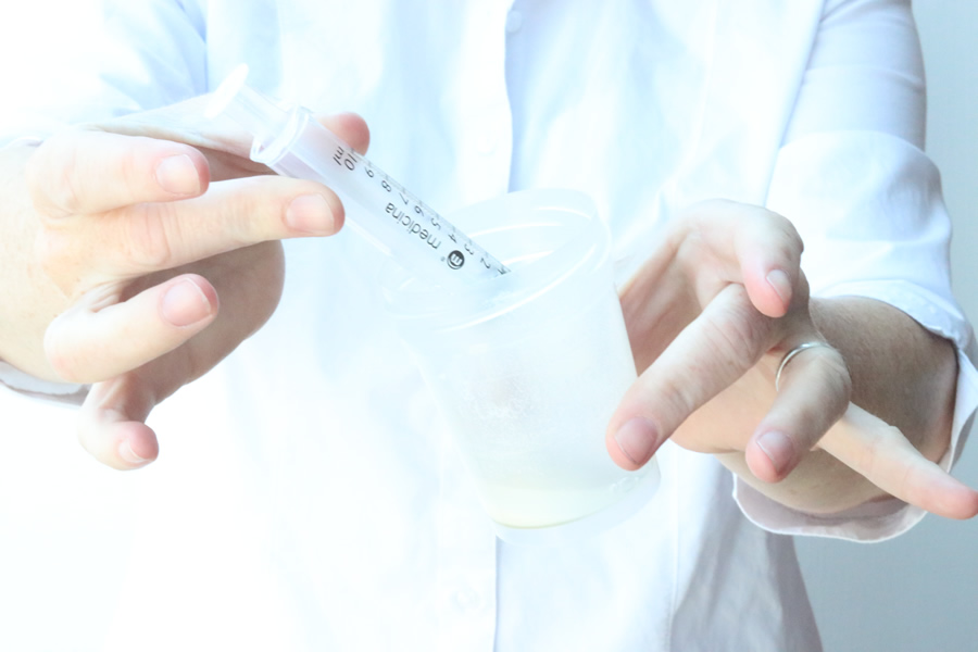 sperm in jar with syringe